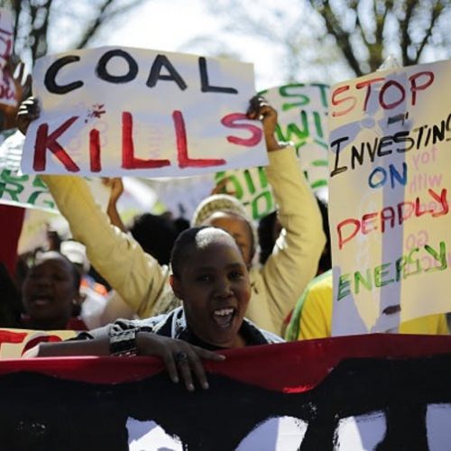Demonstrators in Johannesburg march against environmental damage done by coal.
Photo by Cornell Tukiri/Anadolu Agency/Getty Images