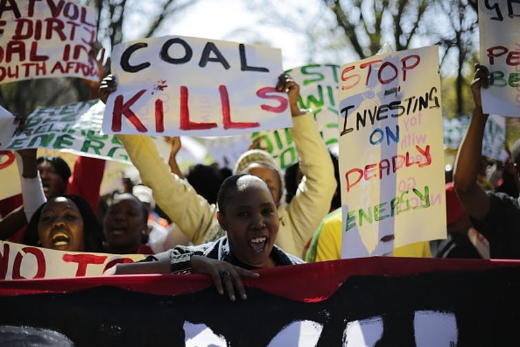 Demonstrators in Johannesburg march against environmental damage done by coal.
Photo by Cornell Tukiri/Anadolu Agency/Getty Images