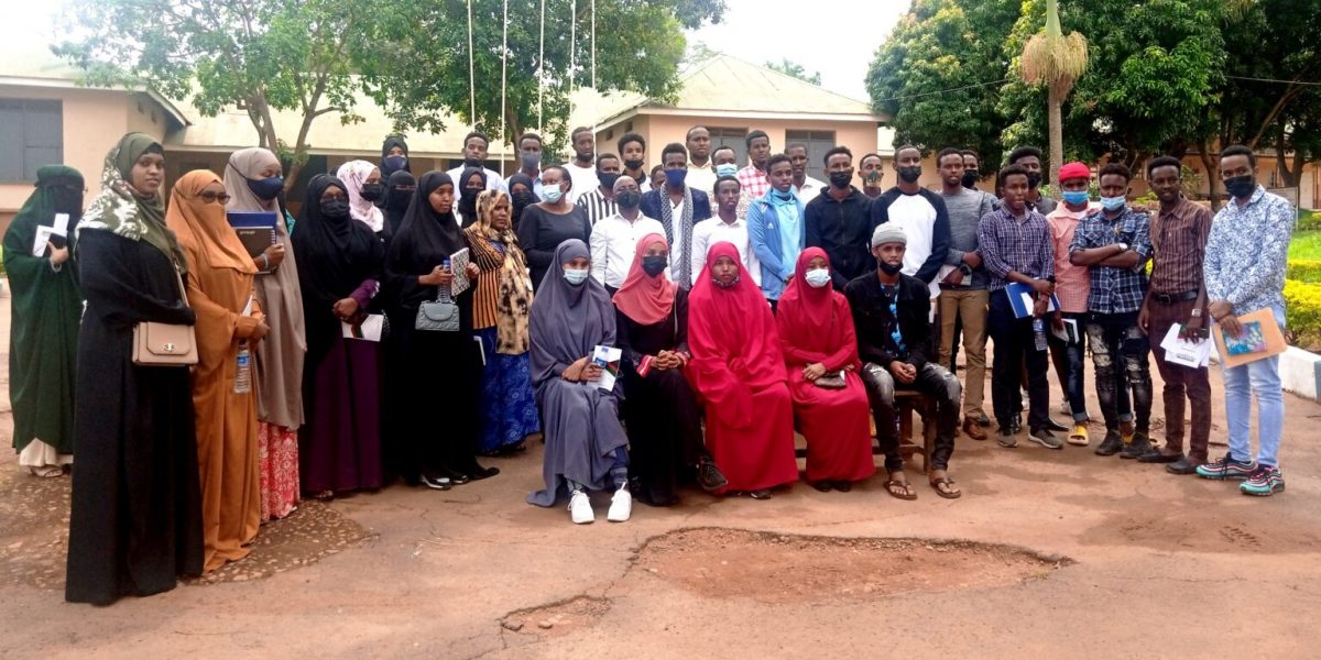 The Project PI-Dr. Anthony Tibaingana (Centre in white shirt) and part of the research team with some of the over 70 Somali refugees attending a three month-long training in entrepreneurship at Lubiri High School, Kampala after the first class on 25th October 2021.