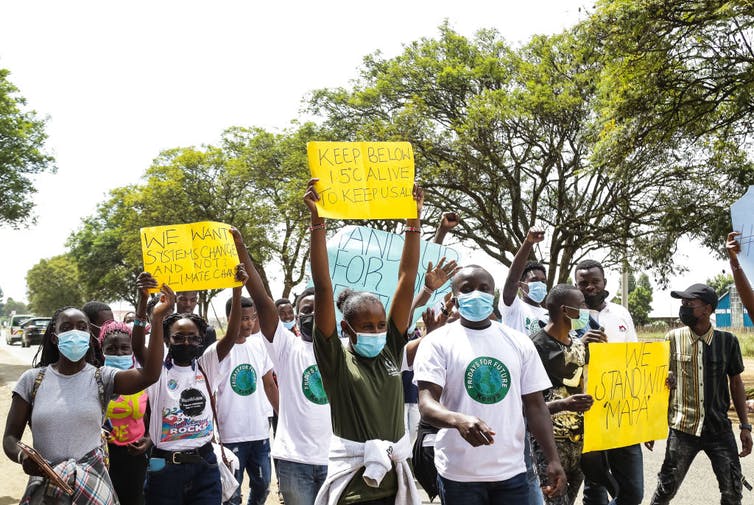 Activists hold placards during a climate change protest in Kenya.
James Wakibia/SOPA Images/LightRocket via Getty Images
