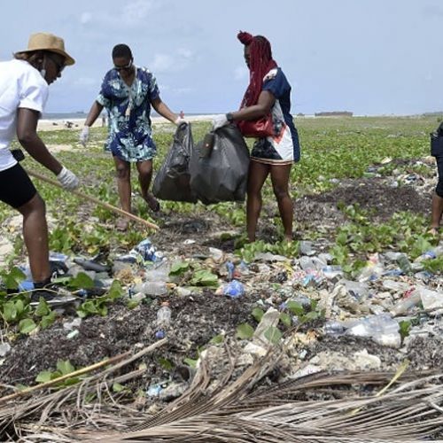 Volunteers gather at a beach, to clean up plastic litter at a Lagos beach.
PIUS UTOMI EKPEI/AFP via Getty Images