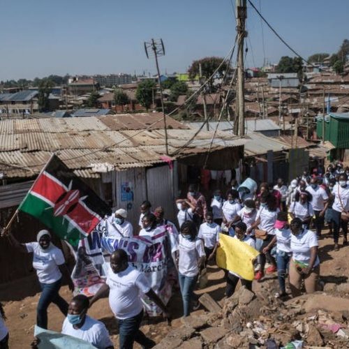 Human rights defenders speaking out for women march through an informal settlement in Nairobi.
Photo by Yasuyoshi CHIBA / AFP